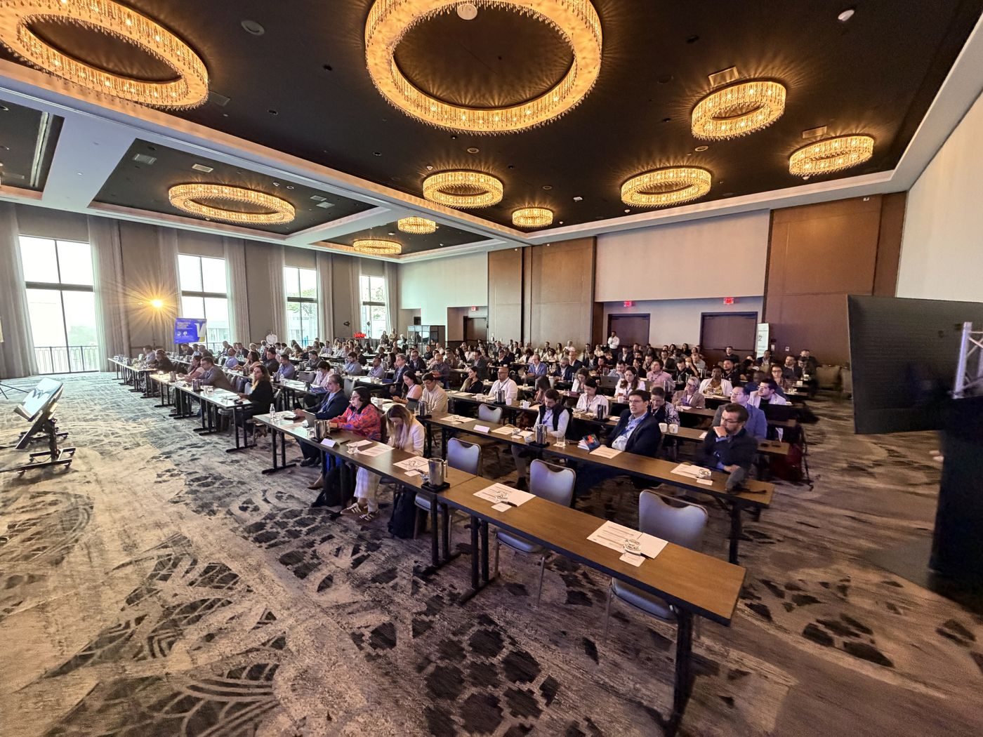 Wide view of a corporate conference ballroom during a general session