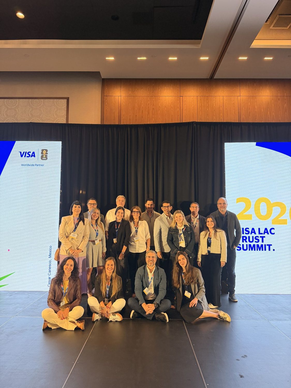 Event team group photo on stage after a corporate summit