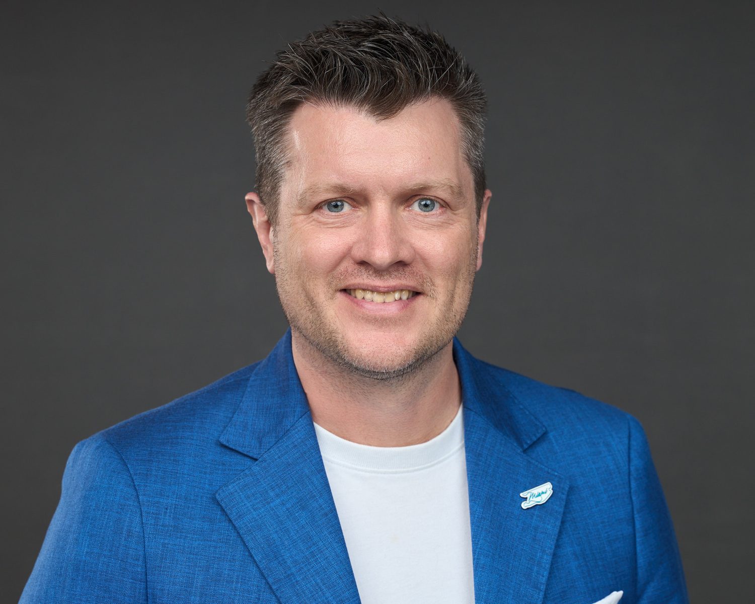 Corporate event headshot of a conference speaker