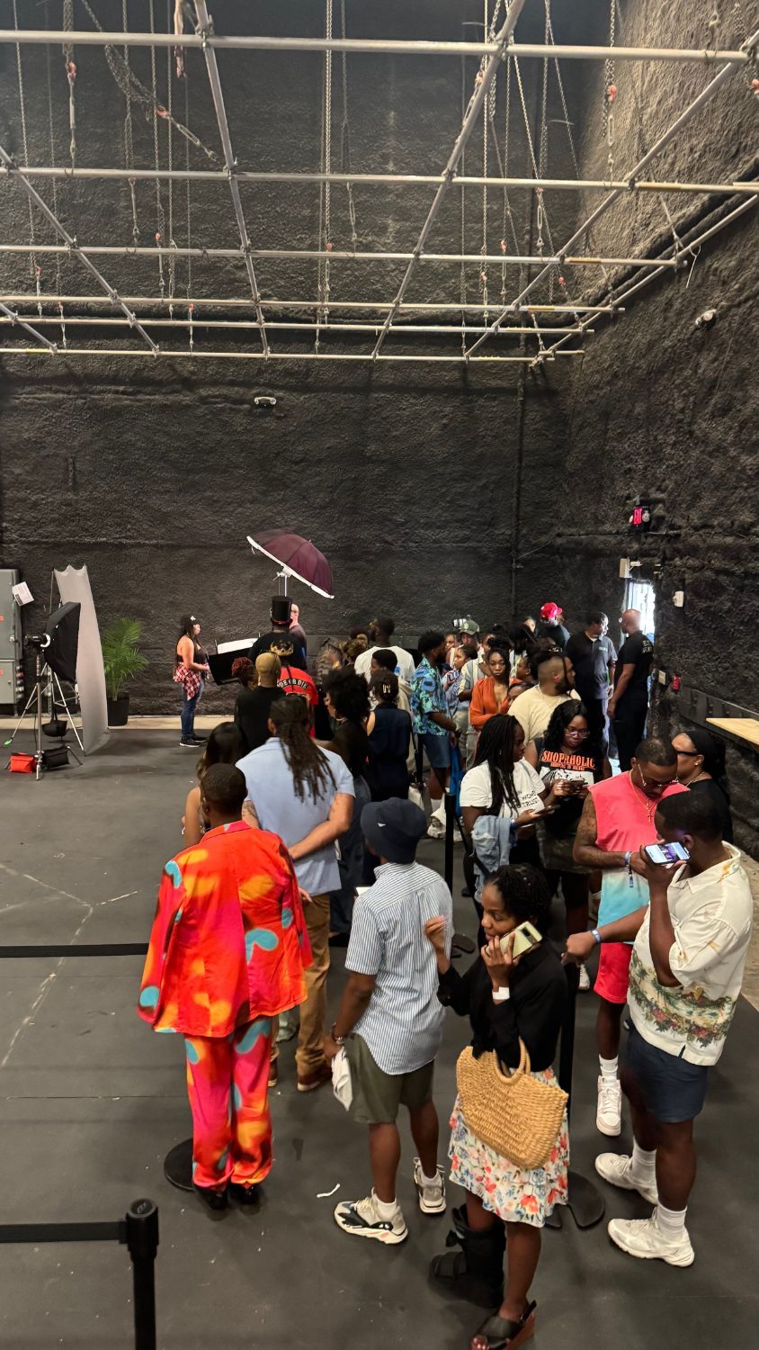 Attendees lining up for headshots at a large event
