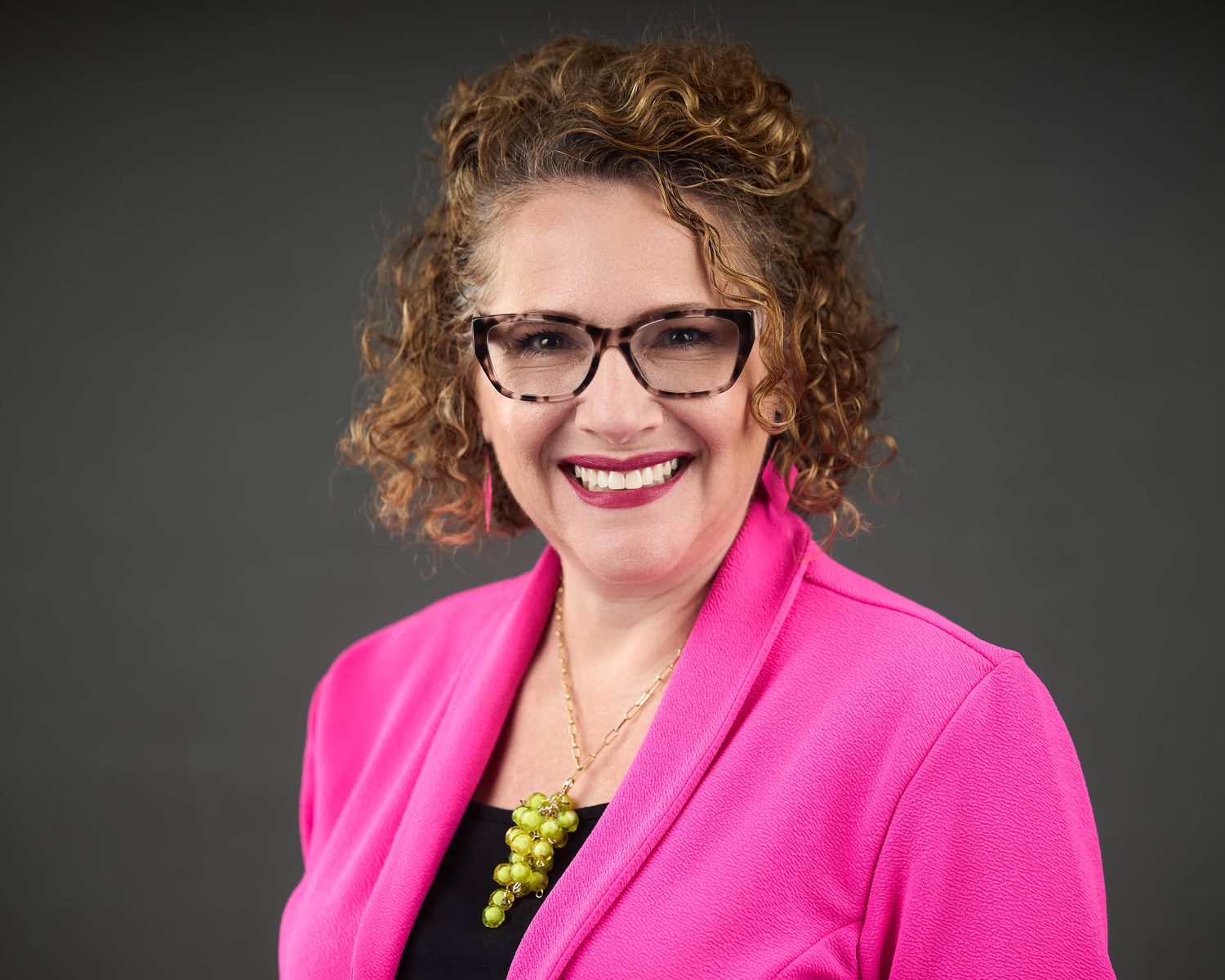 Professional business headshot taken during an on-site team session