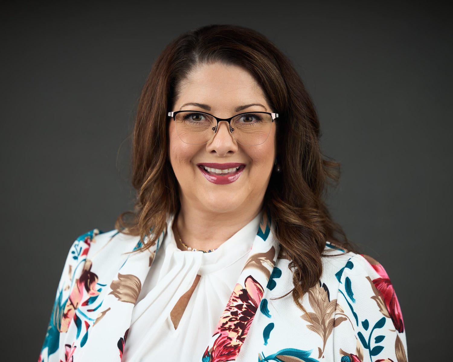 Corporate headshot photographed on site with studio lighting